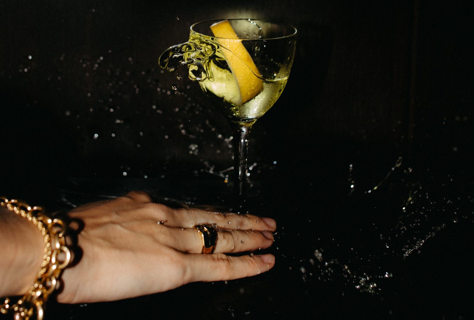 A hand holding a coupe cocktail at Bar Fiori